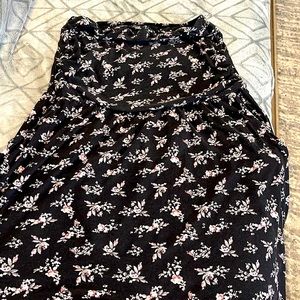 Guilty size large black strapless dress with floral pattern.